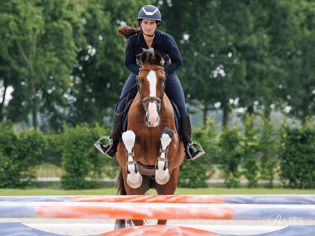 Where Jump Saddles Lose Riders: Stability Under the Leg